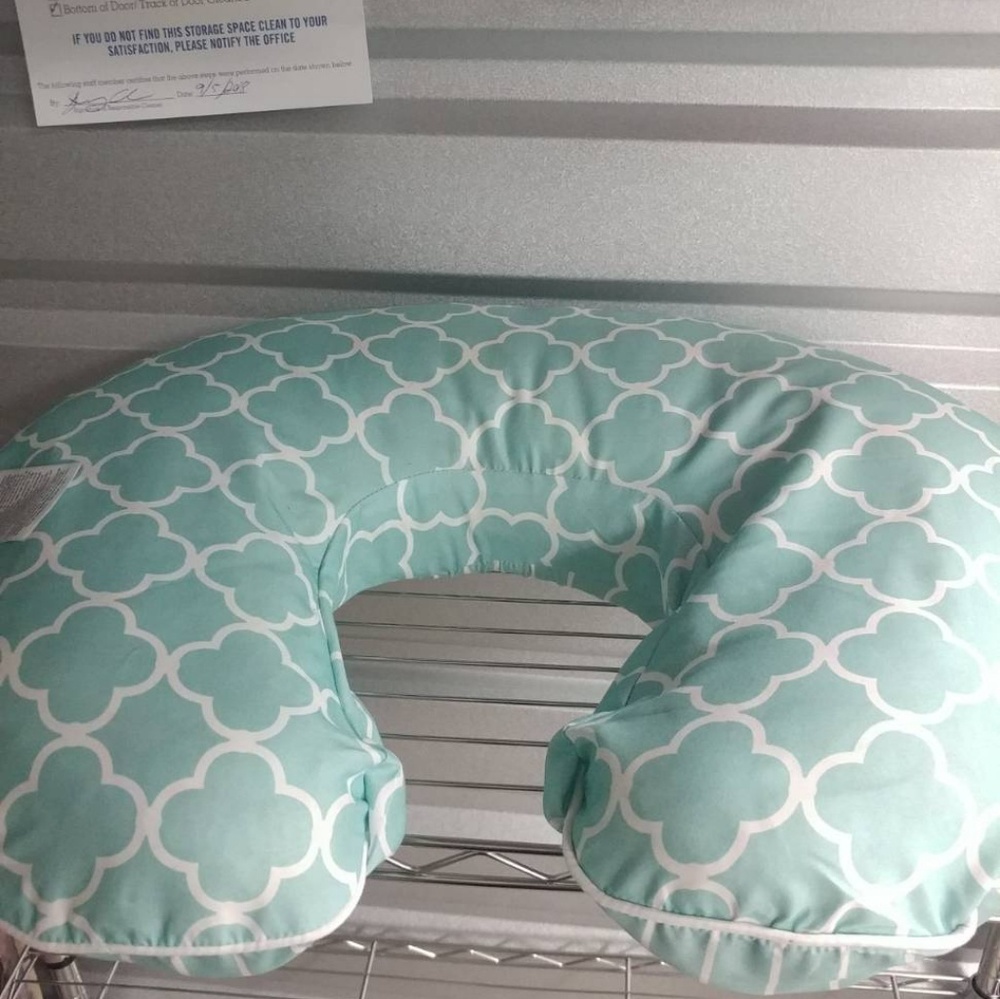 Two nursing pillows and an extra Boppy cover +